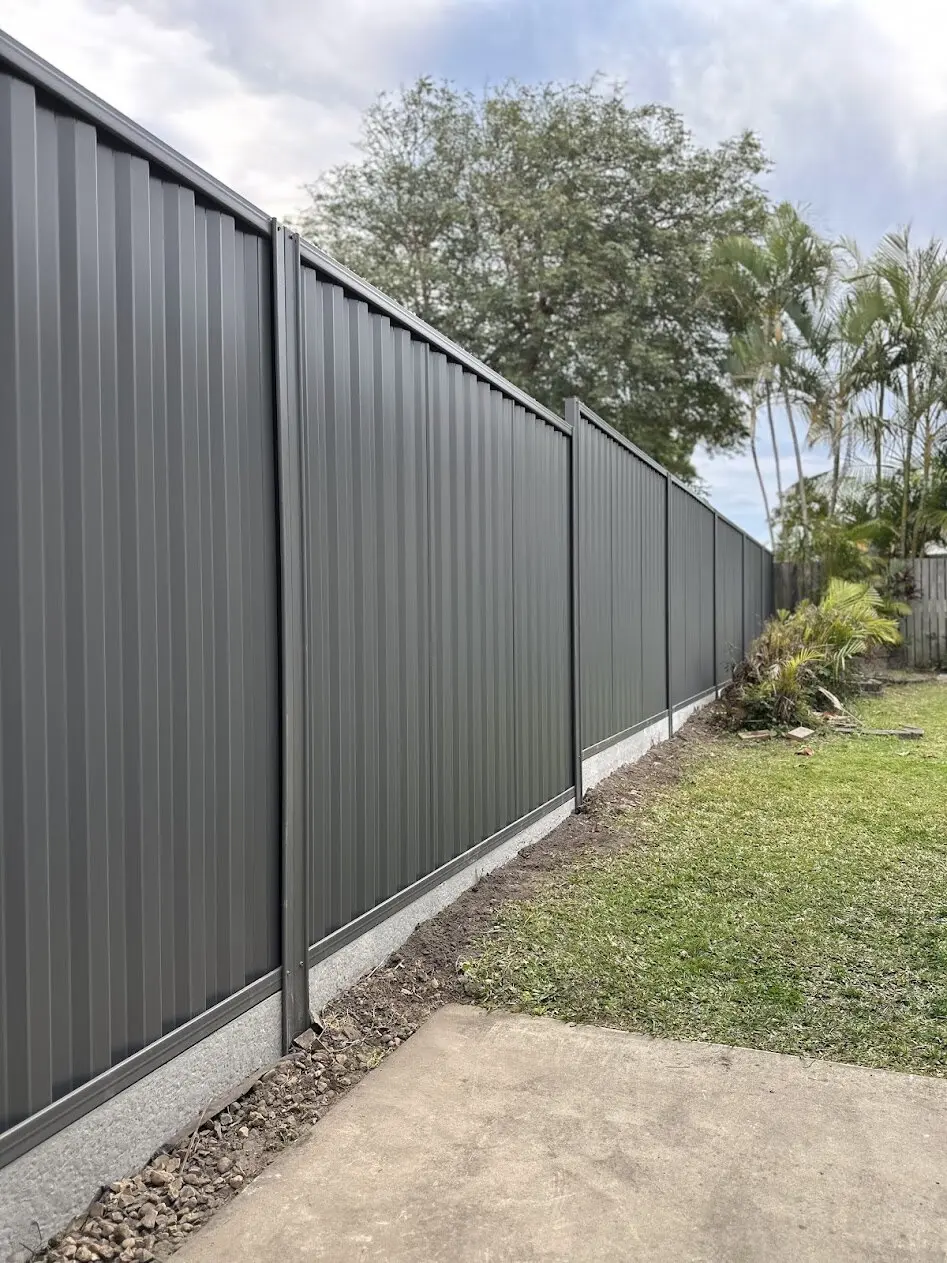 Grey Colorbond fence on concrete plinths, built by Elite 7 Fencing